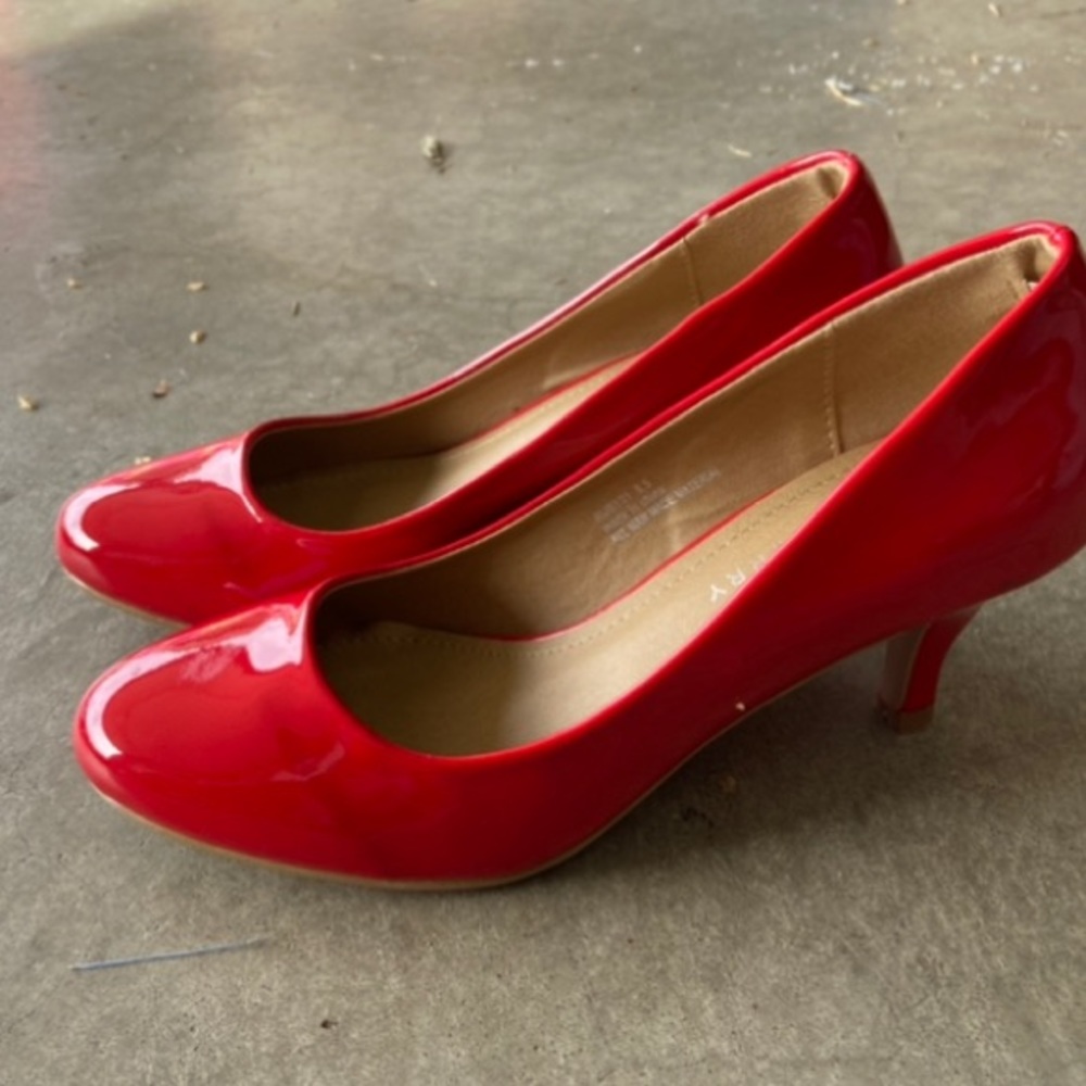 Red high heals. Worn once for a wedding. Size 6.5.